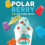 A promotional graphic for the 'Polar Berry' shaved ice from Bahama Buck's. The image shows a cup of light blue shaved ice generously topped with colorful gummy bear candies and a yellow paper umbrella.
