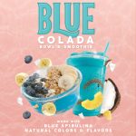 Promotional ad for the 'Blue Colada Bowl & Smoothie' from Bahama Buck's. The image features the vibrant blue smoothie and a matching bowl topped with blueberries, bananas, and granola. Floating ingredients like pineapple and coconut surround the products. Text reads: 'made with BLUE SPIRULINA, Natural Colors & Flavors.